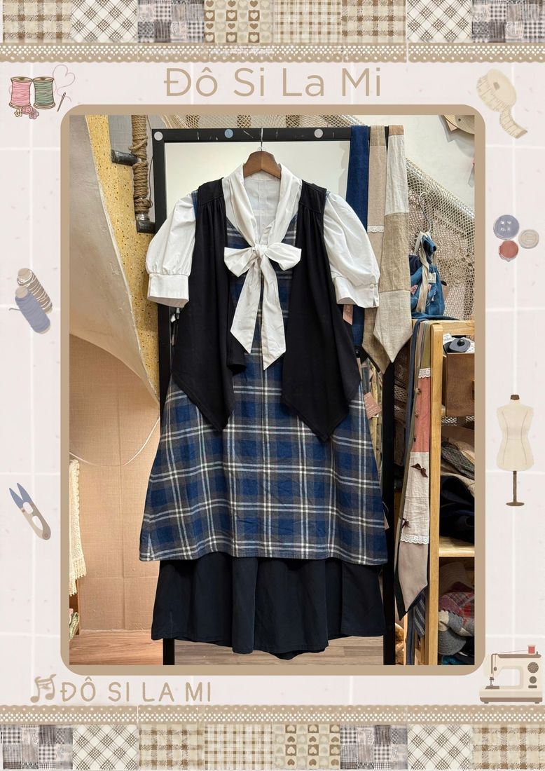 Áo trắng nơ cổ phối gile caro xanh navy và chân váy caro xanh navy